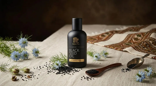 Black seed oil in amber glass bottle with Nigella sativa seeds on natural linen background
