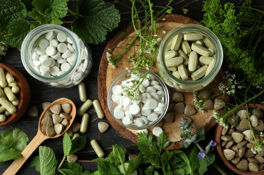 Concept of herbal medicine pills on wooden table