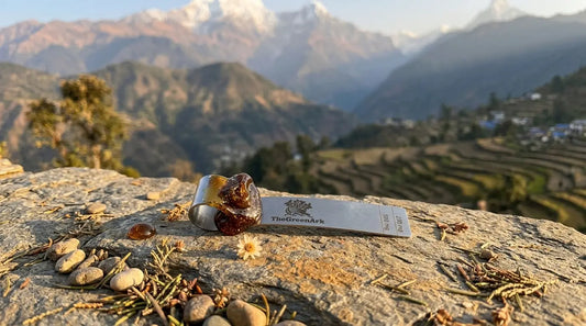 Pure Himalayan shilajit resin on stainless-steel spoon with mountain background