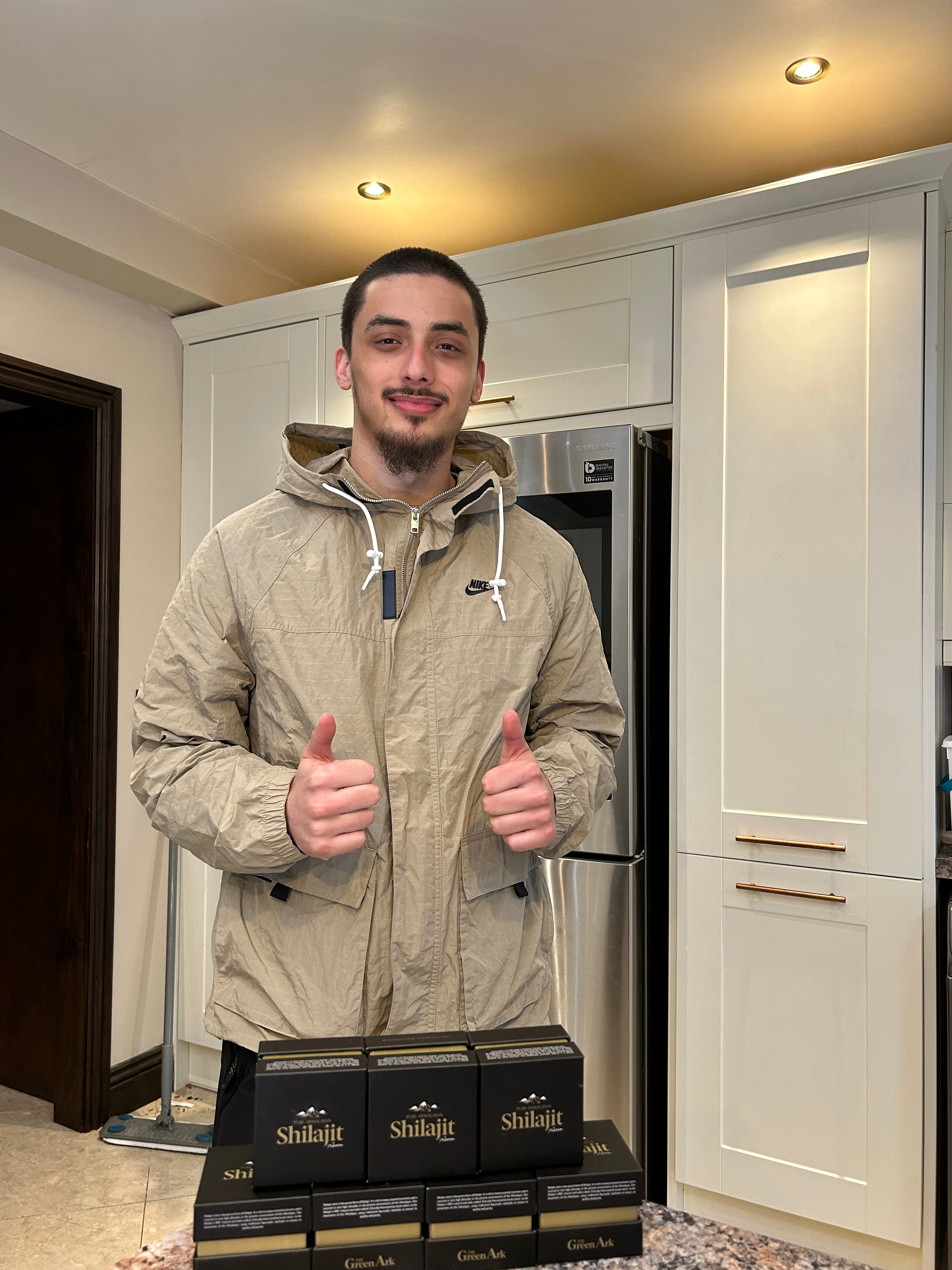 Founder standing with smile.